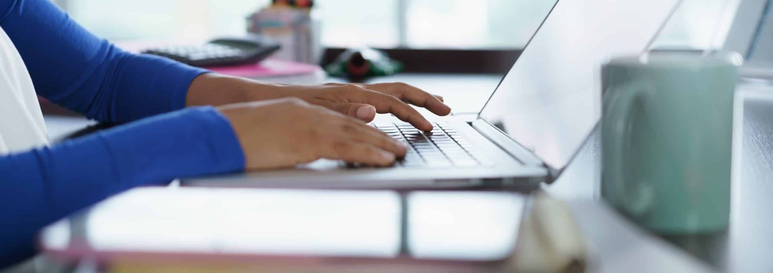 homeschool-student-writing-on-a-computer-for-scoring-service