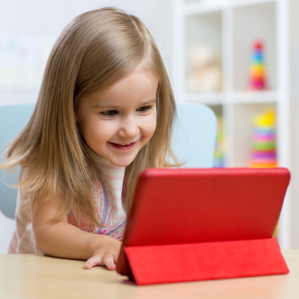 young child using an iPad