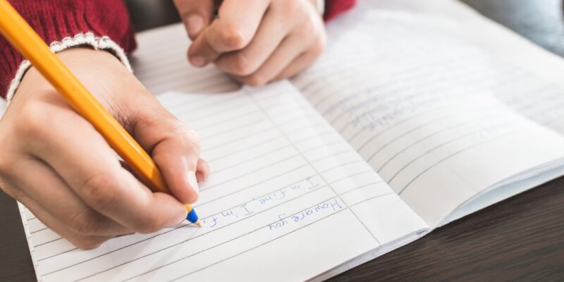 image of a kid writing