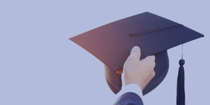 Arm Holding graduation Hat