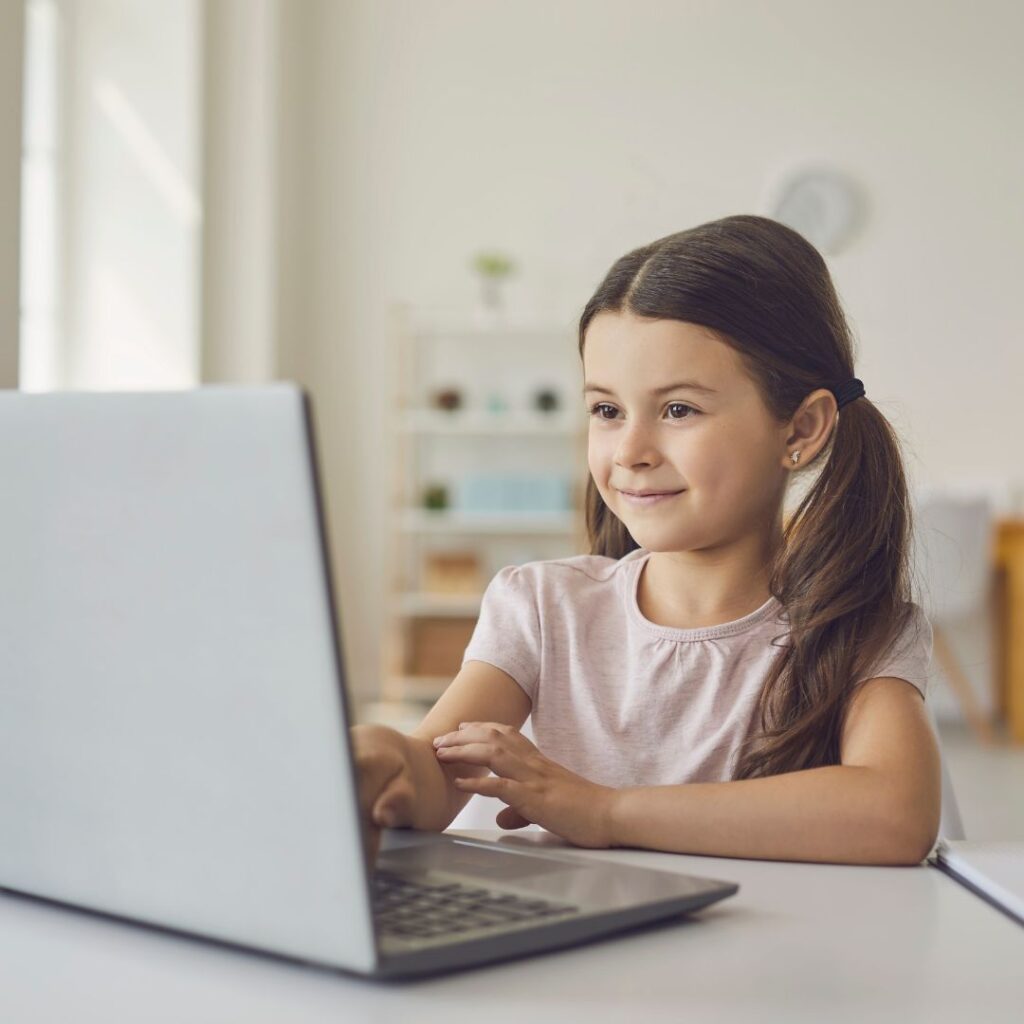 young girl watching a writing lesson