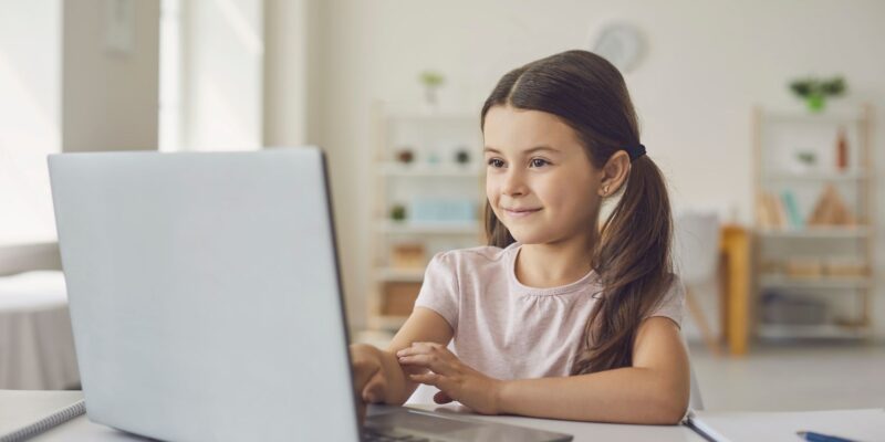 A young student at her computer