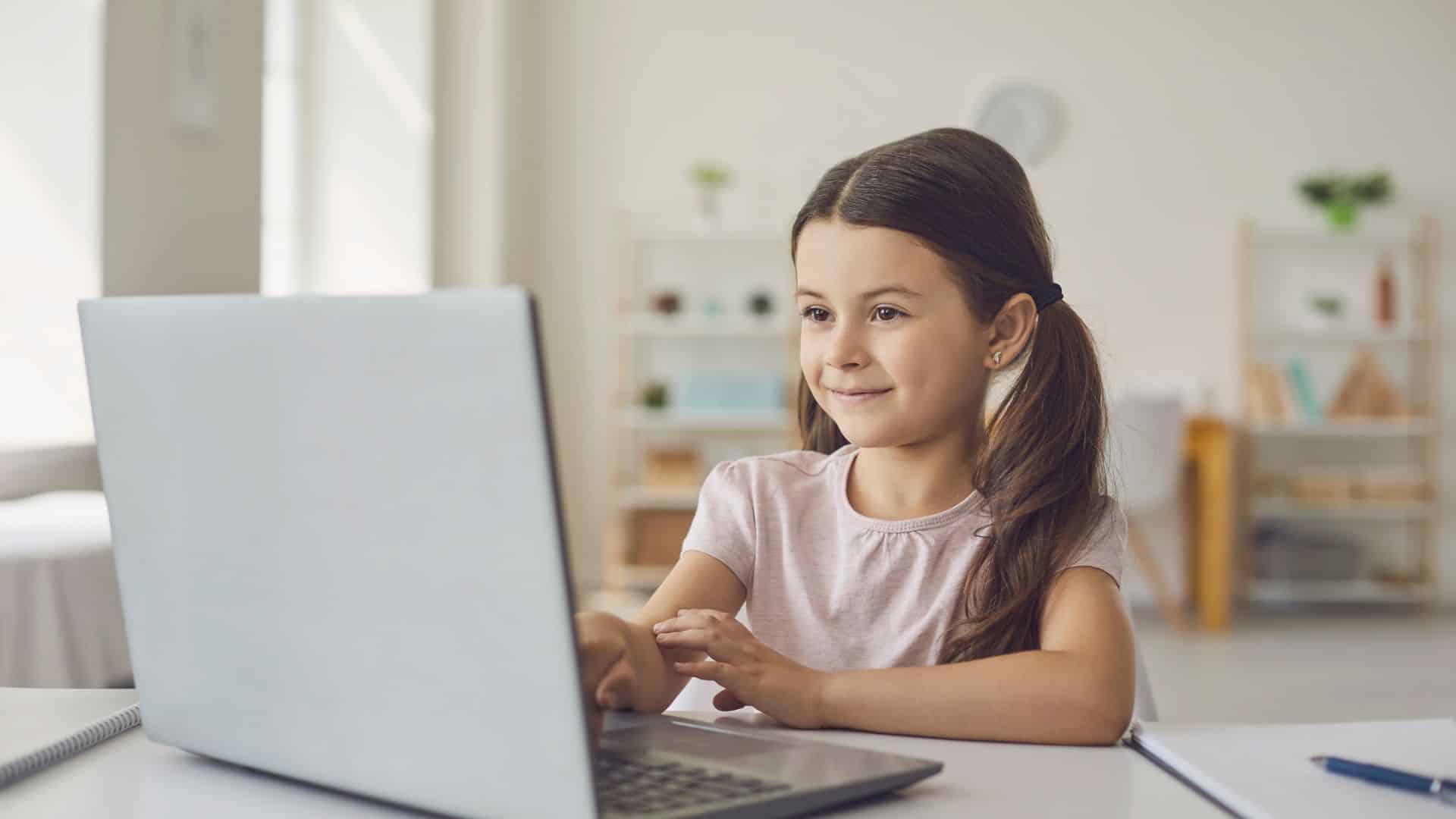A young student at her computer